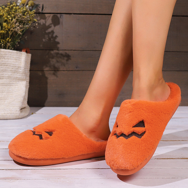 Cute pumpkin plush slippers worn side view