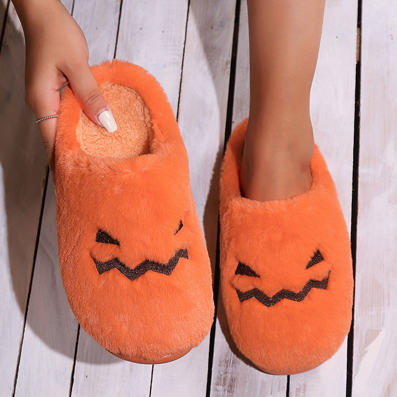 Pumpkin slippers showing plush insole