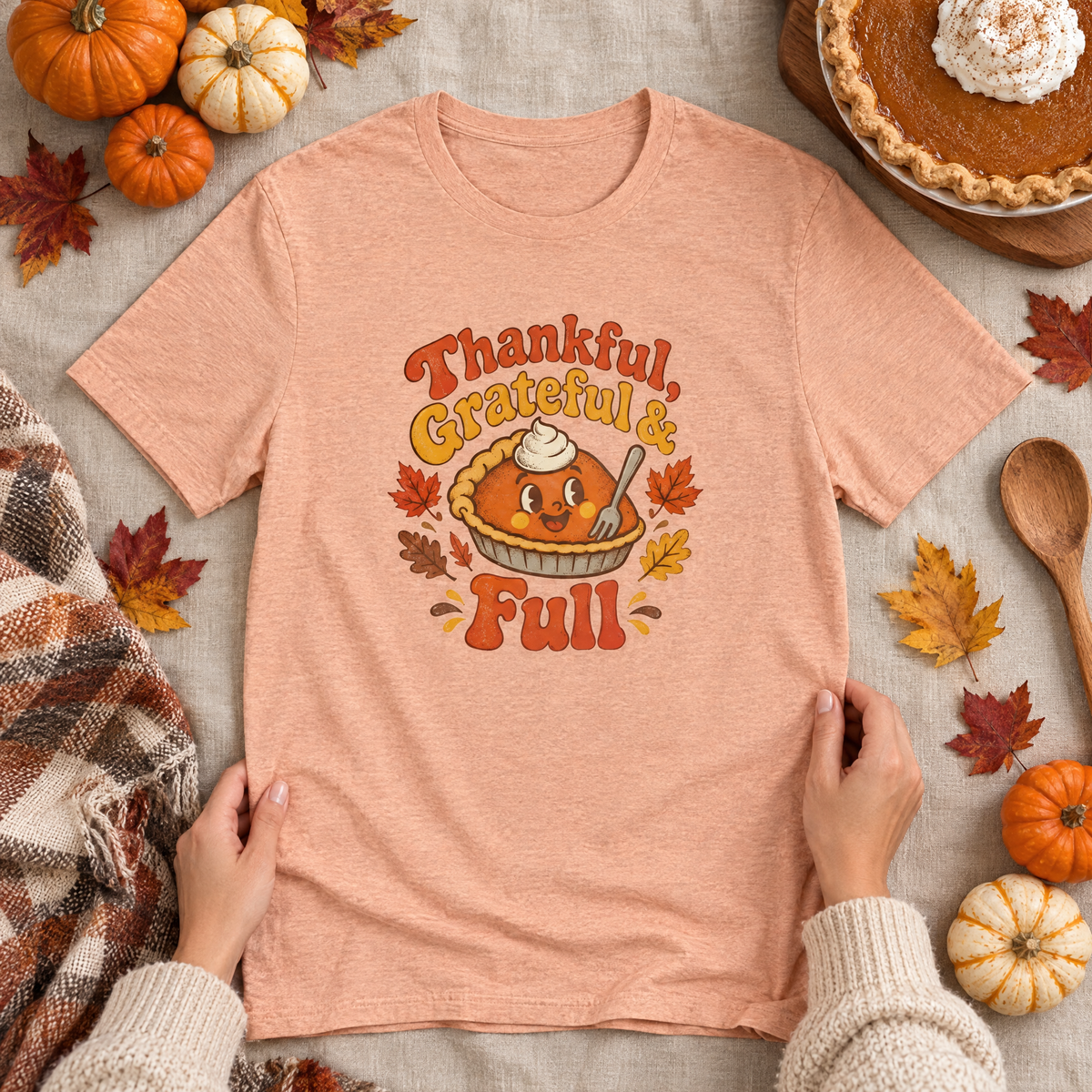 Thankful, Grateful & Full tee flat lay with mini pumpkins, pumpkin pie and autumn leaves