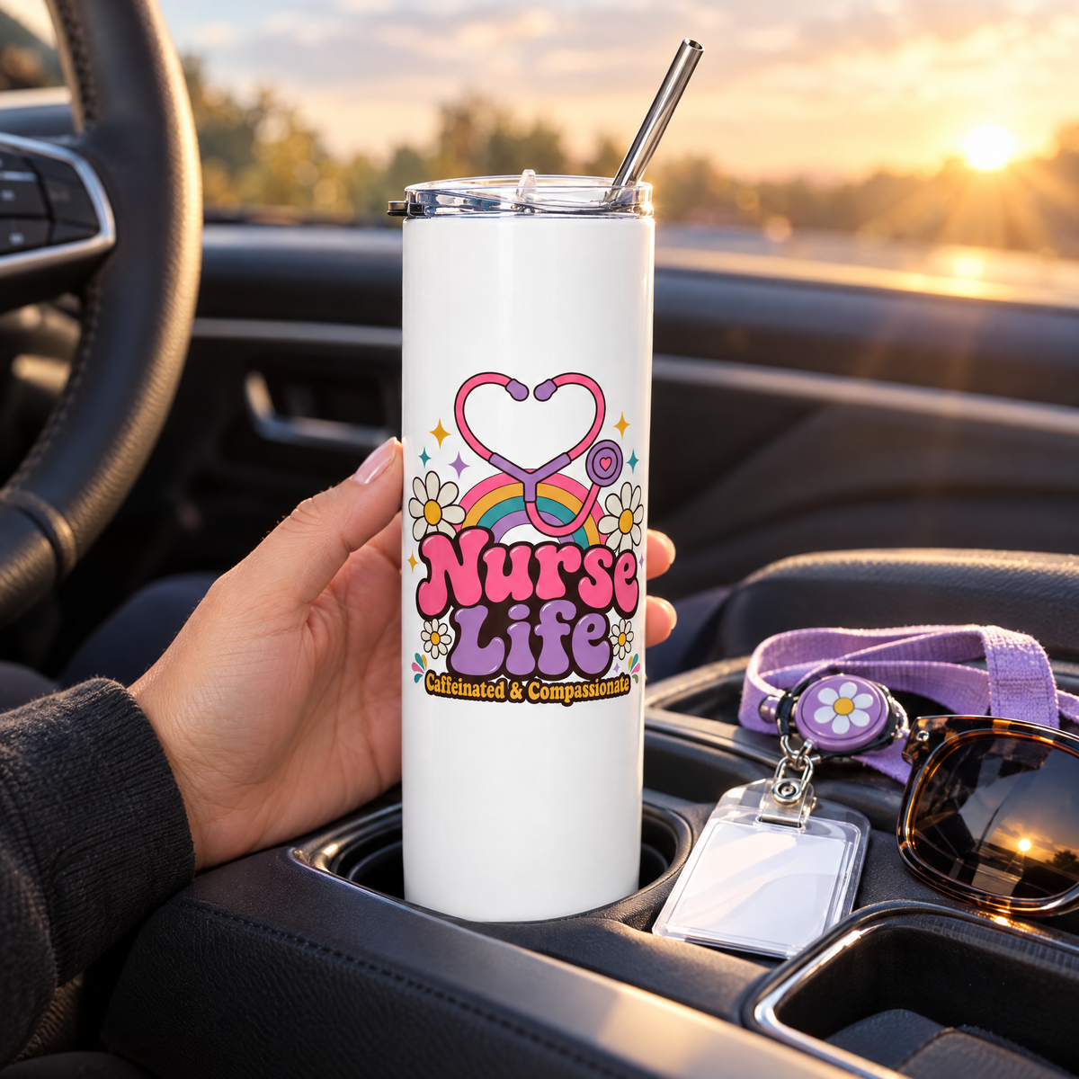 White Nurse Life skinny tumbler with metal straw in a car cupholder at sunrise with a badge reel