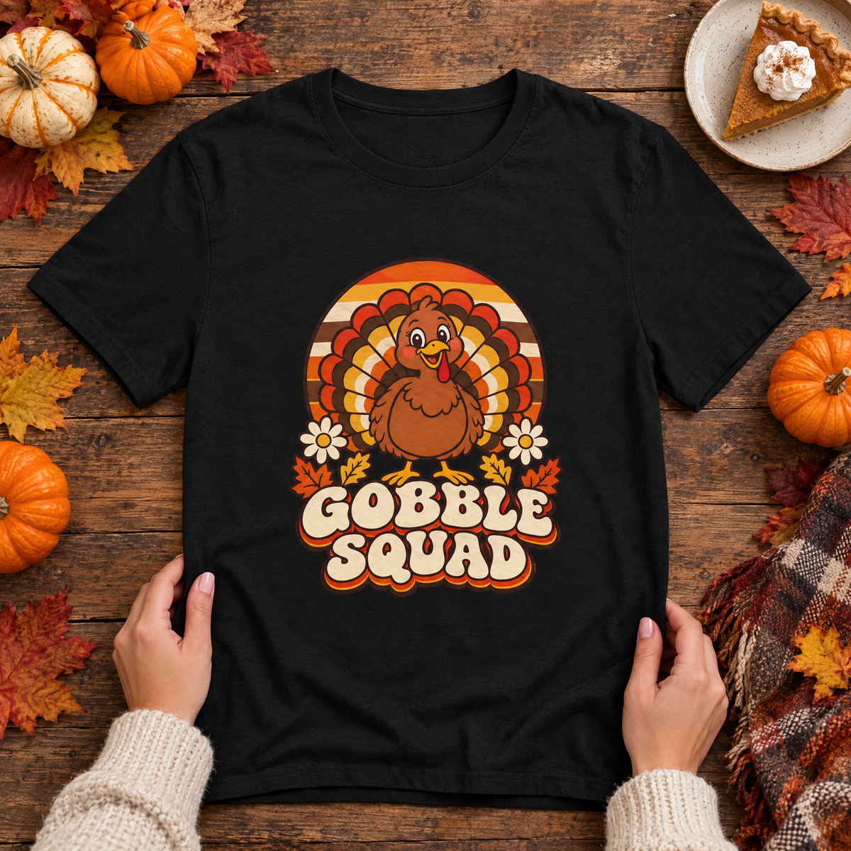 Gobble Squad retro turkey tee flat lay with mini pumpkins, autumn leaves and pie