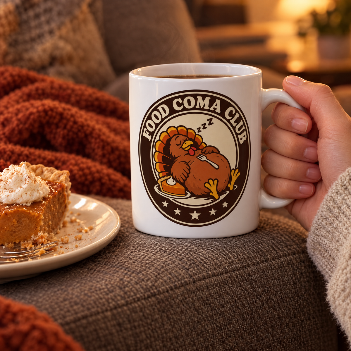 Food Coma Club mug on a couch armrest next to a slice of leftover pumpkin pie